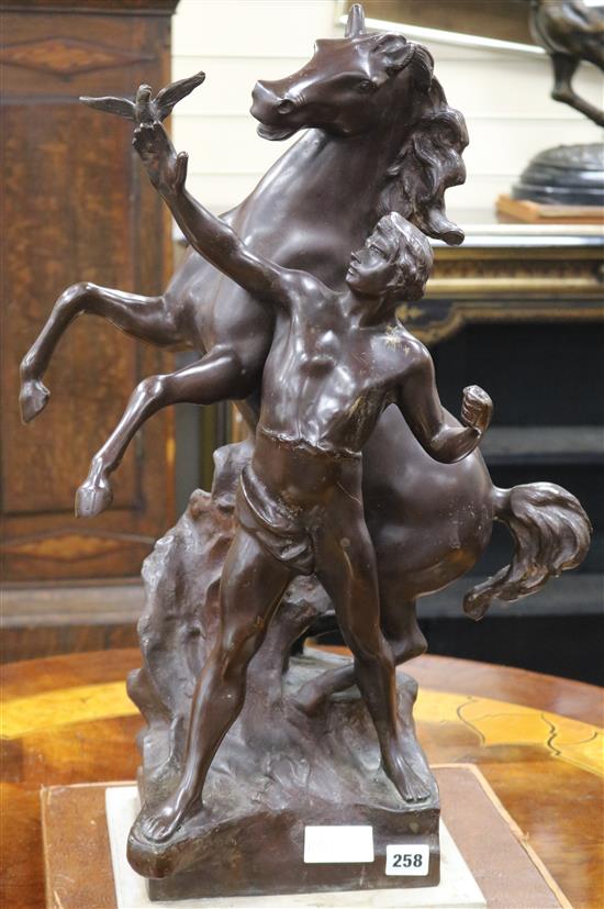 A bronze group of a man and a stallion height 64cm